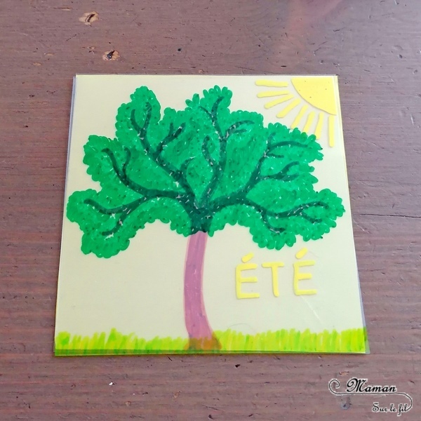 Activité manuelle et créative enfants - Fabriquer un jeu DIY autour des 4 saisons - Arbre modulable et cycle de la nature - Transparents et dessin - changements de l'arbre au fil des saisons - été, automne, printemps et hiver - fleurs, neige, feuilles mortes, soleil - plusieurs étages - couleurs - Bricolage Fait Maison- Feuilles plastiques transparentes - Marqueurs peinture - Bricolage et Créativité - Maternelle - Cycle 1 - Nature et Printemps - mslf