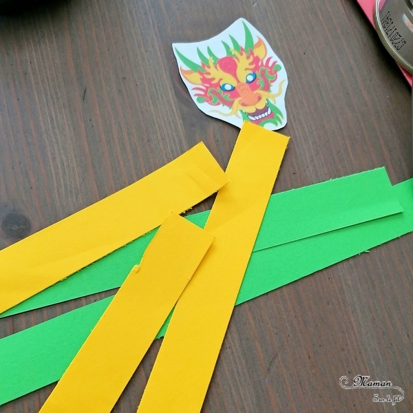 Activité créative, manuelle enfants - Bricolage ludique d'une boite surprise avec dragon chinois sur ressort - boite de conserve recyclée et ressort en papier - pliage de papier pour l'accordéon - Créativité - Nouvel an chinois - Asie et Chine - Découverte d'un pays - Espace et géographie - arts visuels et atelier maternelle et Cycle 2 - mslf