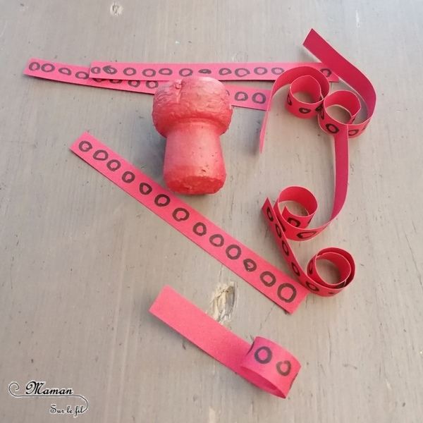 Activité créative et manuelle enfants - Pieuvre rouge en récup' - Fabriquer un poulpe avec un bouchon en liège et des bandes de papier - Peinture - Motricité fine pour papier enroulé - Graphisme pour cercles des tentacules - Bricolage rapide et facile - Yeux mobiles - Thèmes animaux marins, plage et été - Surcyclage et Créativité - arts visuels et atelier maternelle et Cycle 1 et 2 - mslf