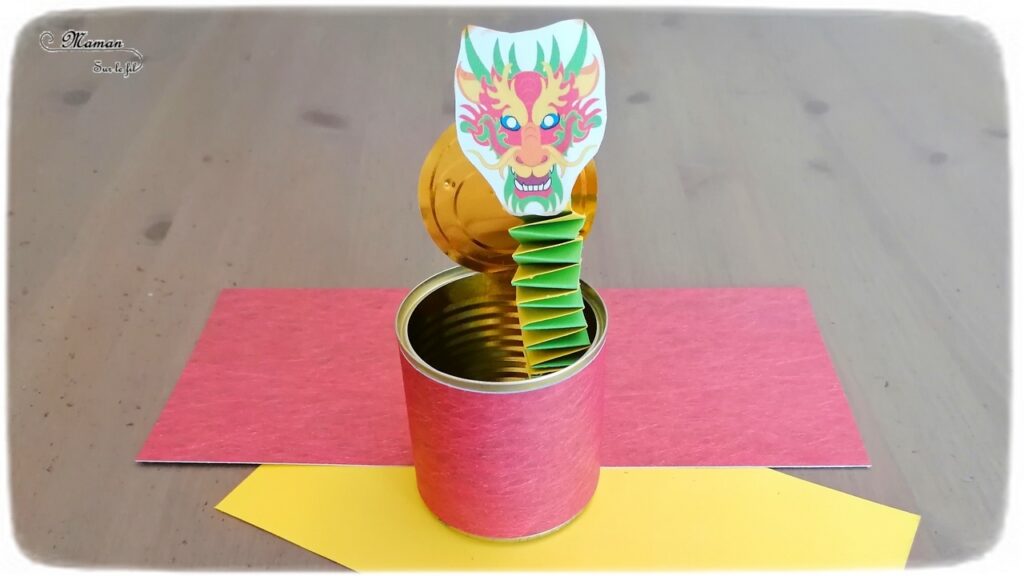 Activité créative, manuelle enfants - Bricolage ludique d'une boîte surprise avec dragon chinois sur ressort - boite de conserve recyclée et ressort en papier - pliage de papier pour l'accordéon - Créativité - Nouvel an chinois - Asie et Chine - Découverte d'un pays - Espace et géographie - arts visuels et atelier maternelle et Cycle 2 - mslf