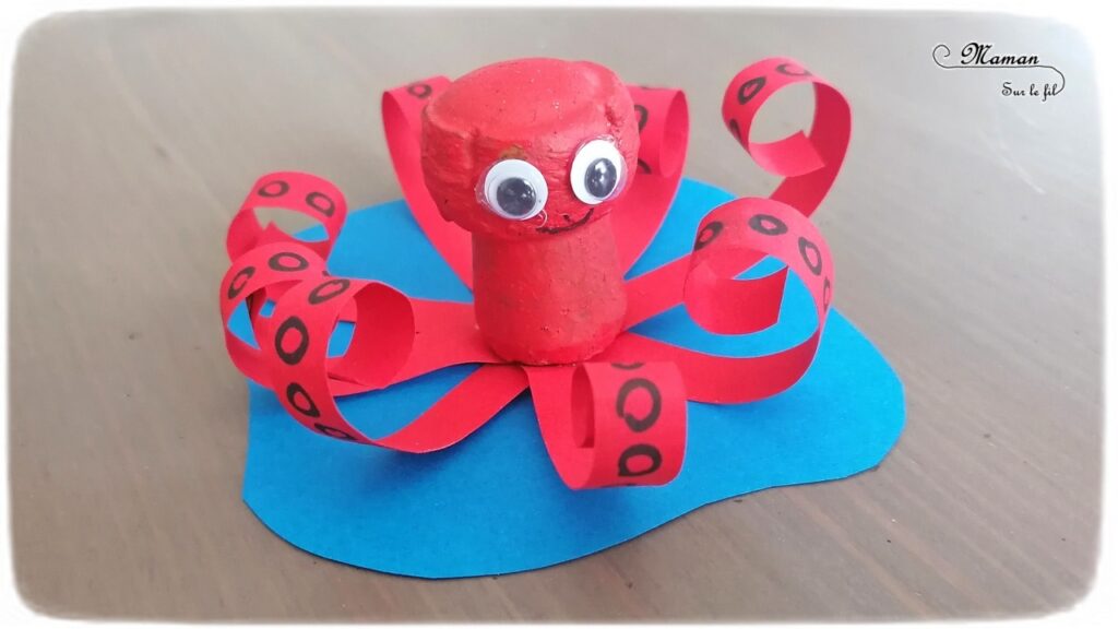 Activité créative et manuelle enfants - Pieuvre rouge en récup' - Fabriquer un poulpe avec un bouchon en liège et des bandes de papier - Peinture - Motricité fine pour papier enroulé - Graphisme pour cercles des tentacules - Bricolage rapide et facile - Yeux mobiles - Thèmes animaux marins, plage et été - Surcyclage et Créativité - arts visuels et atelier maternelle et Cycle 1 et 2 - mslf