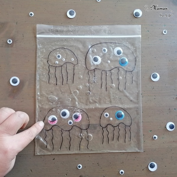 Activité sensorielle, créative et manuelle enfants - Jeu DIY sensoriel - Remets les yeux aux méduses - motricité fine - sac congélation, gel, yeux mobiles - dénombrement - association de couleurs - Dessin - Créativité - arts visuels et atelier maternelle et élémentaire - Cycle 1 ou pré-scolaire - Animaux marins et mer, océans ou été - mslf