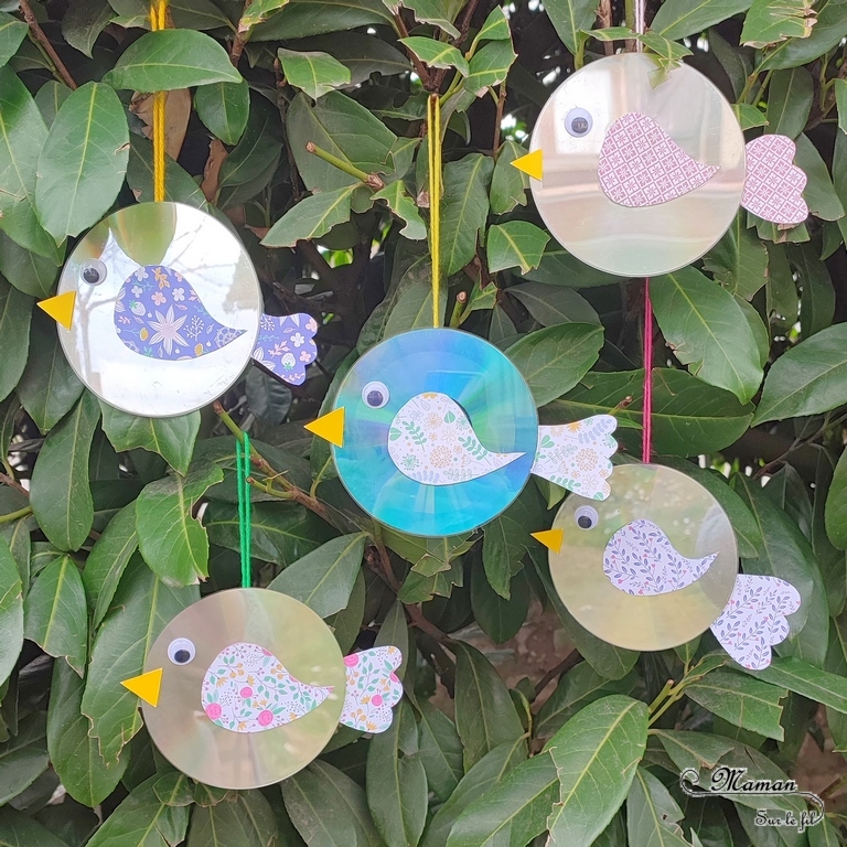 Activité créative et manuelle enfants - Fabriquer des oiseaux avec de vieux CD - Récup, recyclage, surcyclage - Découpage, collage de papier à motifs printaniers - Suspension avec de la laine pour le jardin ou décoration - Peut servir à éloigner les oiseaux des arbres fruitiers ou des plantations (cerisier par exemple) grâce aux reflets - ou éloigner les pigeons des balcons - Bricolage facile et rapide pour le printemps - Arts visuels Maternelle et élémentaire - Créativité - Cycle 1 ou 2 - mslf