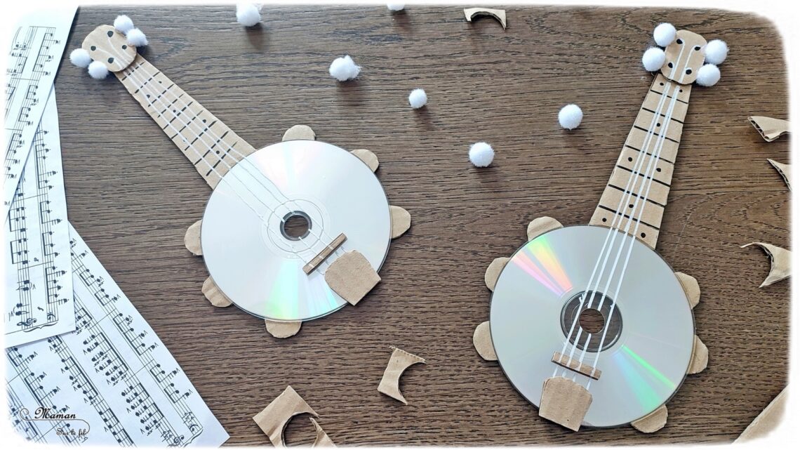 Activité créative et manuelle enfants - Fabriquer des banjos avec des CD et du carton - Bricolage récup' avec des pompons - Récup, recyclage, surcyclage - Découpage, bricolage, collage - Bricolage facile et rapide pour un thème sur la fête de la musique - Arts visuels et atelier Maternelle et élémentaire - Créativité - Cycle 1 ou 2 - tutoriel photos - mslf