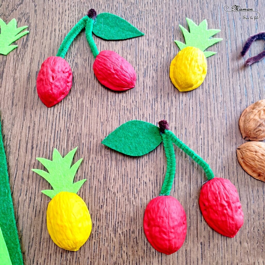 Activité créative, manuelle et récup' enfants - Fabriquer des ananas et des cerises avec des coquilles de noix - Recyclage et surcyclage - Peinture, découpage, collage feutrine et fils chenille - Décoration tropicale - Nature - Fruits d'été et exotiques - Tropiques - Bricolage facile et rapide pour un thème sur les aliments, les fruits ou l'été - Arts visuels et atelier Maternelle et élémentaire - Créativité - Cycle 1 ou 2 - tutoriel photos - mslf