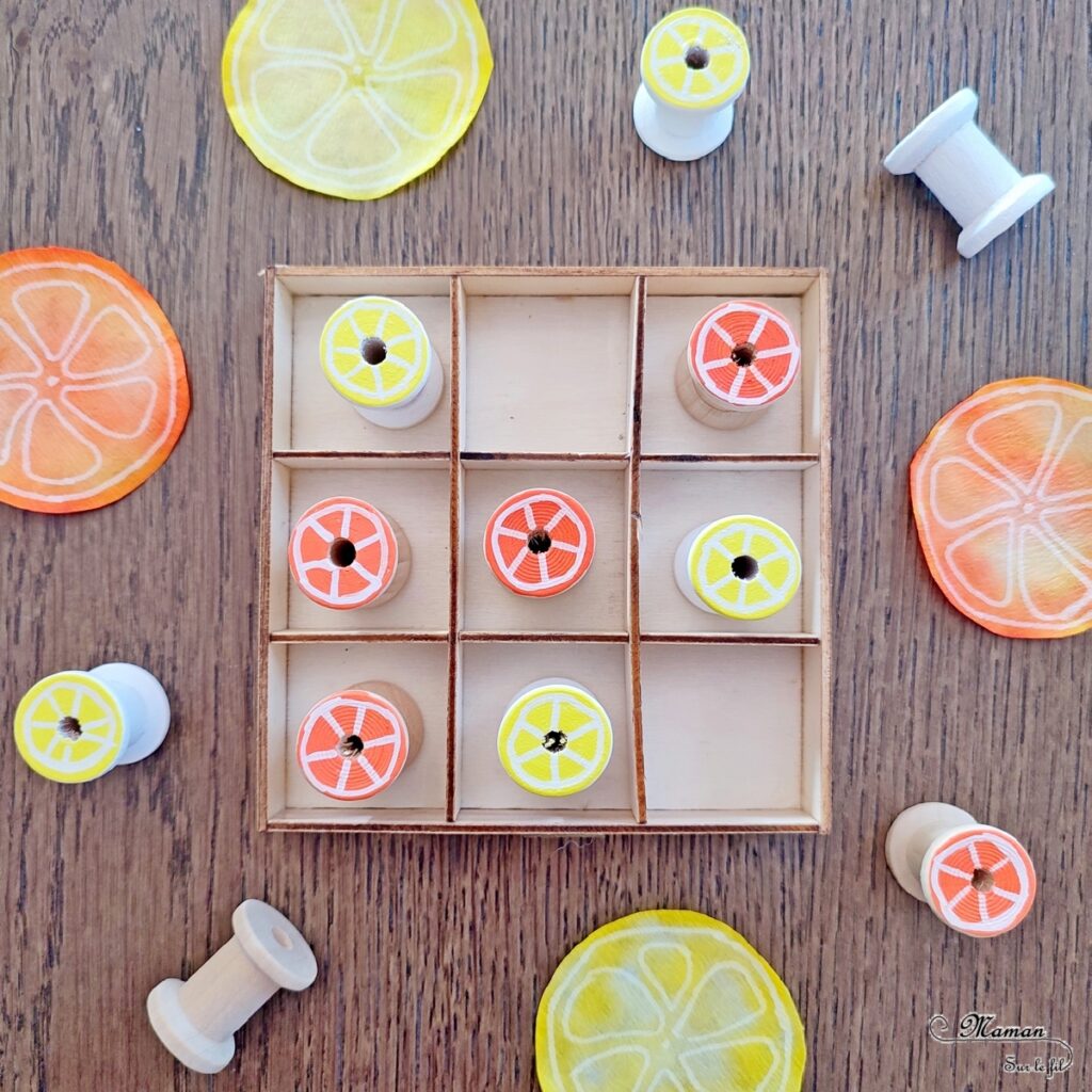 Activité créative et manuelle enfants - Fabriquer un jeu de morpion fruits d'été fait maison - Bricolage facile DIY et récup' - Recyclage de boîte et bobines de fils en bois - Dessin de fruits estivaux et agrumes : citrons et oranges - Tic Tac Toe et Oxo : jeu de logique - Bricolage facile et rigolo - Recyclage et surcyclage - Aliments, fruits, été - Arts visuels Maternelle et élémentaire - Créativité - Cycle 1 ou 2 - mslf