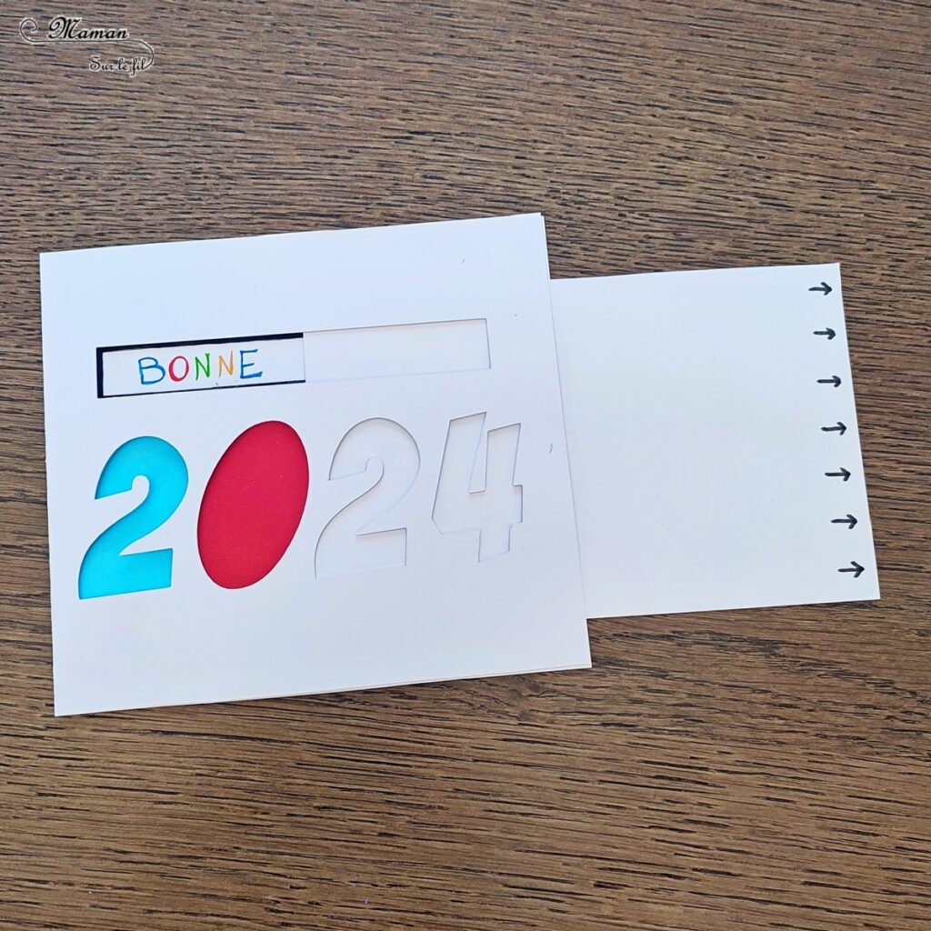 Fabriquer une carte surprise pour fêter la nouvelle année : activité créative et manuelle enfants - Bricolage d'une carte DIY qui se colore et laisse apparaître un message de bonne année quand on tire la languette comme indiqué - Carte de voeux fait maison rigolote et ludique - Découpage et collage - Récup' de chutes de papier coloré - Arts visuels et Bricolage maternelle ou élémentaire (cycles 1, 2 et 3) - Thème Nouvelle année, bonne année, nouvel an - Créativité - tutoriel photos et vidéos - mslf