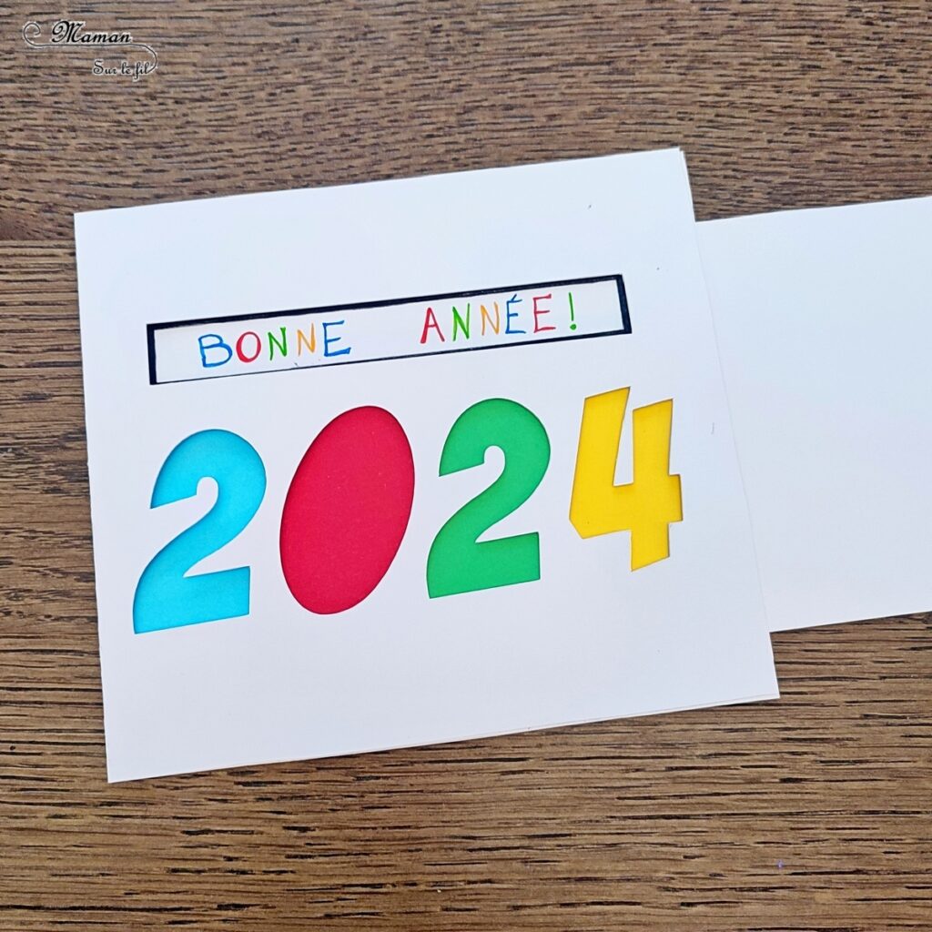 Fabriquer une carte surprise pour fêter la nouvelle année : activité créative et manuelle enfants - Bricolage d'une carte DIY qui se colore et laisse apparaître un message de bonne année quand on tire la languette comme indiqué - Carte de voeux fait maison rigolote et ludique - Découpage et collage - Récup' de chutes de papier coloré - Arts visuels et Bricolage maternelle ou élémentaire (cycles 1, 2 et 3) - Thème Nouvelle année, bonne année, nouvel an - Créativité - tutoriel photos et vidéos - mslf