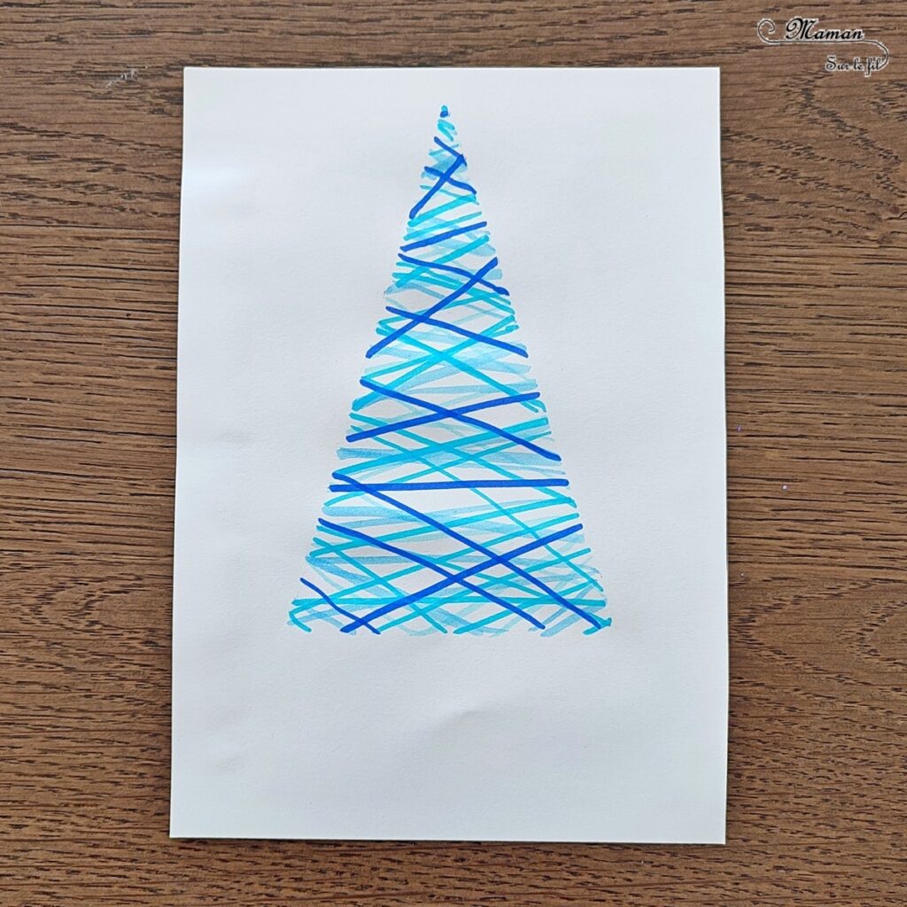 Activité créative et manuelle enfants - Dessiner un sapin hivernal avec des traits de feutres et un pochoir - Dessin, couleurs et nuances de bleu, découpage, collage des lettres du mot hiver - Couleurs hivernales Bleu et blanc - Arts visuels et Bricolage - Thème forêt, arbres, hiver, sapins, Noël - Bricolage et activité facile et rapide - Arts visuels et atelier Maternelle et élémentaire - Créativité - Cycle 1 ou 2 - tutoriel photos et vidéos - mslf