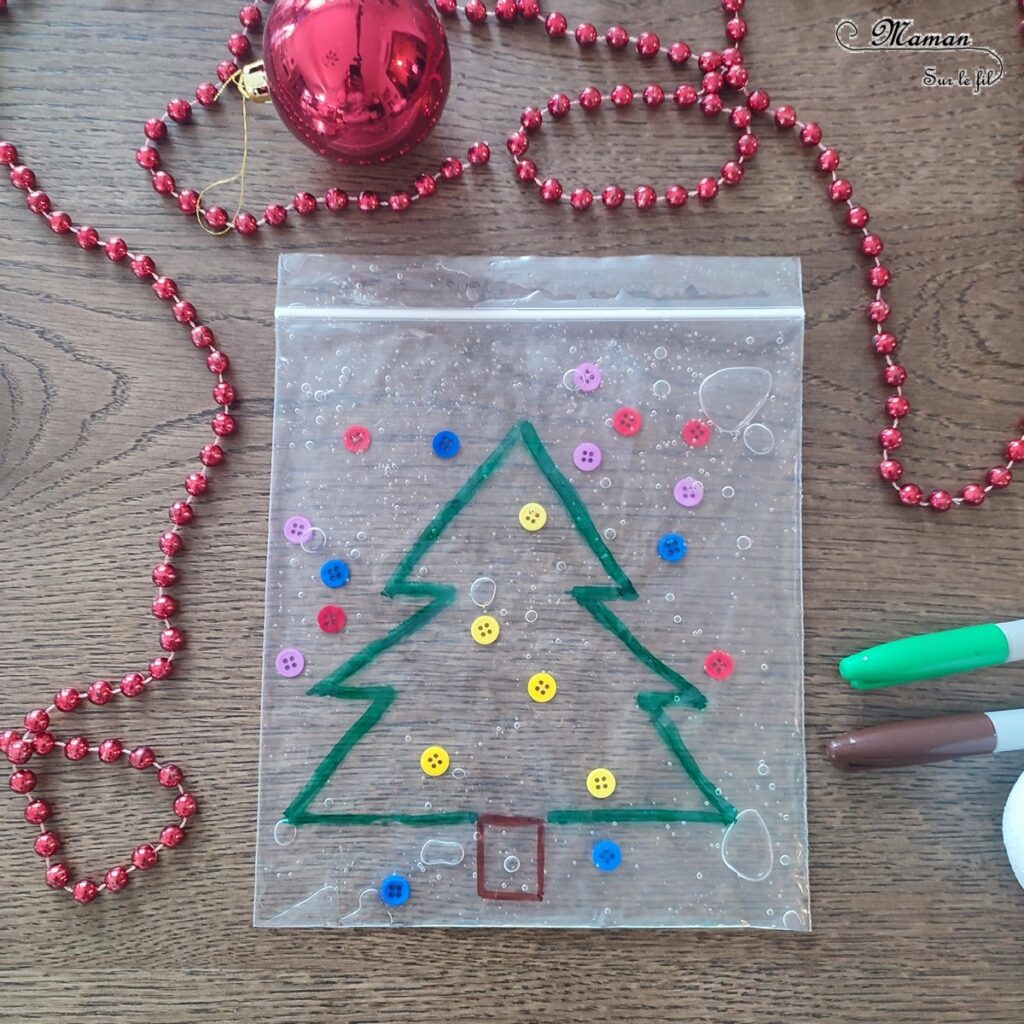 Activité créative, manuelle et sensorielle enfants - Sapin sensoriel à décorer à volonté - Sac congélation, boutons et gel à coiffer - Jeu et atelier DIY pour travailler diverses compétences : sensoriel libre, dénombrement, tri couleurs - Pour patienter avant Noël - Récup' - Arts visuels - Thème hiver, Avent, Noël, sapins - Bricolage facile - Arts visuels et atelier Maternelle et élémentaire - Créativité - Cycle 1 ou 2 - tutoriel photos et vidéo - mslf