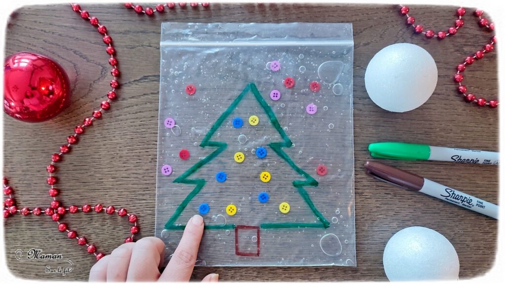 Activité créative, manuelle et sensorielle enfants - Sapin sensoriel à décorer à volonté - Sac congélation, boutons et gel à coiffer - Jeu et atelier DIY pour travailler diverses compétences : sensoriel libre, dénombrement, tri couleurs - Pour patienter avant Noël - Récup' - Arts visuels - Thème hiver, Avent, Noël, sapins - Bricolage facile - Arts visuels et atelier Maternelle et élémentaire - Créativité - Cycle 1 ou 2 - tutoriel photos et vidéo - mslf