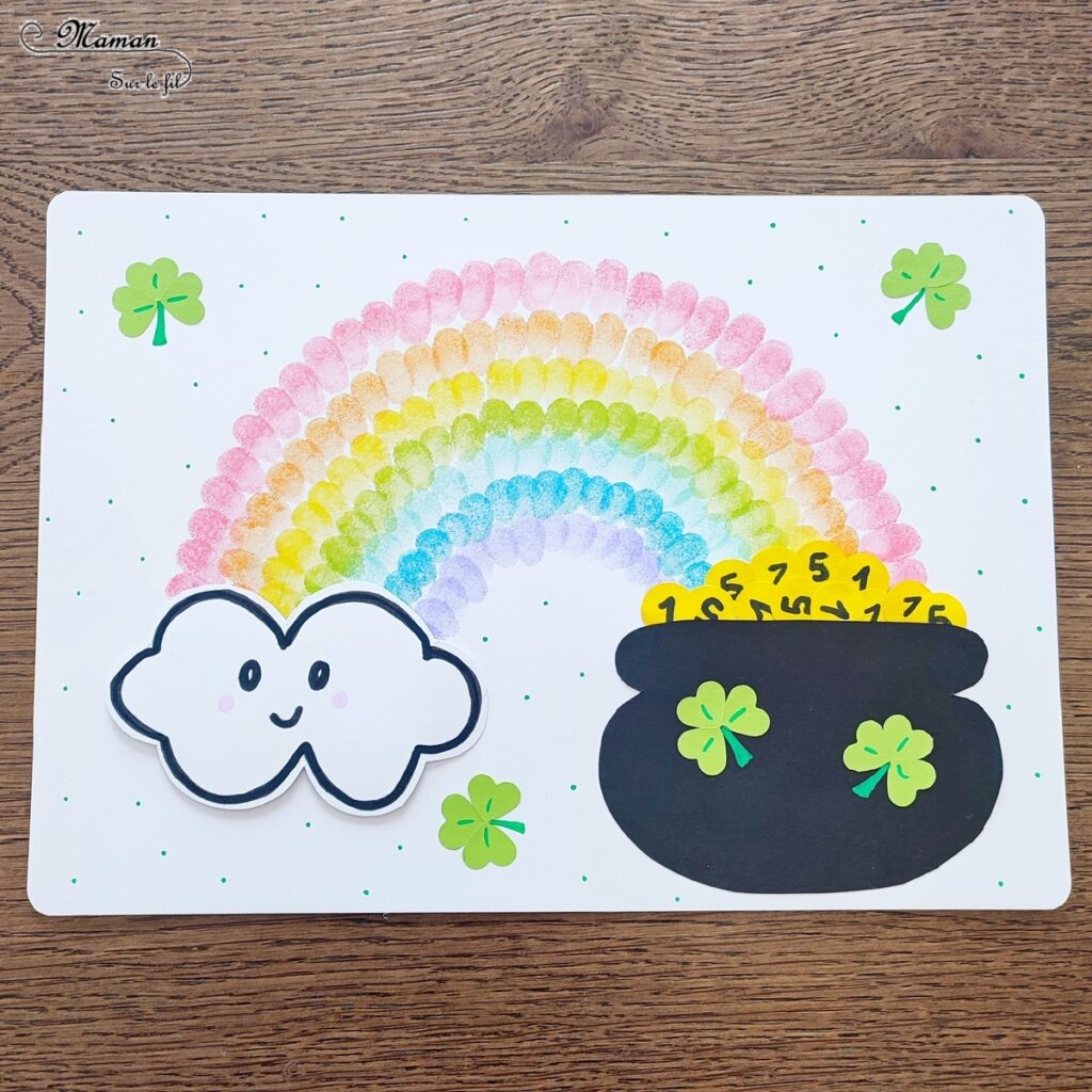 Créer un arc-en-ciel de la Saint-Patrick en empreintes de doigts : activité créative et manuelle enfants - Empreintes de doigts faites avec de l'encre pour tampons - 3 formes de coeur à la perforatrice pour créer les trèfles - Découpage, collage - Dessin et écriture - Chaudron, trésor, pièces, nuages - Arts visuels et Bricolage - Thème Trèfles, Saint-Patrick, Irlande, Géographie, autour du monde - Découverte d'un pays - Bricolage facile et rapide - Arts visuels et atelier Maternelle et élémentaire - Créativité - Cycle 1 ou 2 - tutoriel photos - mslf