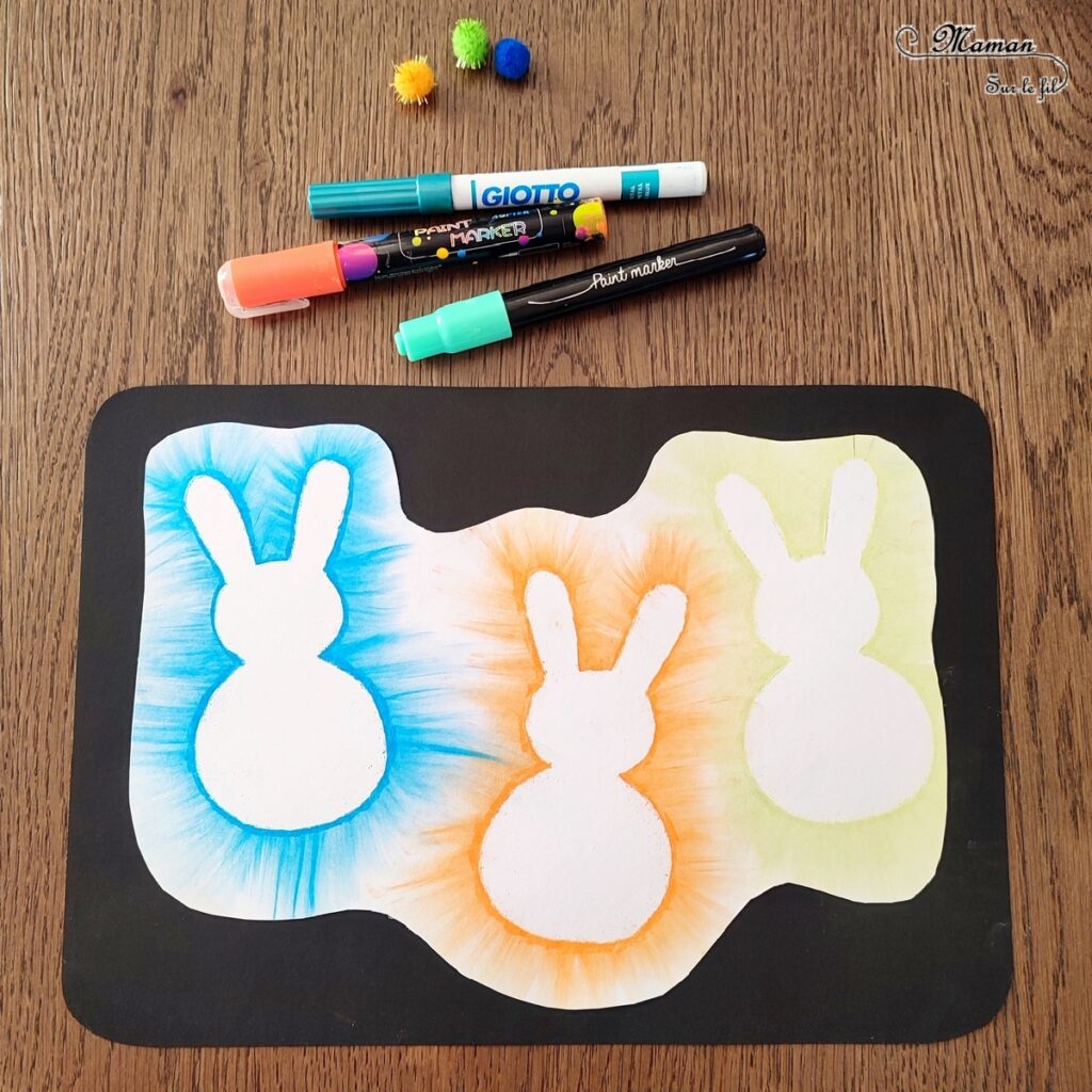 Créer des lapins de Pâques aux pastels étalés : activité créative et manuelle enfants - Technique des pastels étalés au doigt pour un effet lumineux - Pompons pour la queue et le côté mignon - Récup' de chutes de papier pour les pochoirs - Graphismes, découpage, collage - Arts visuels et Bricolage - Thème Pâques et animaux de la ferme - Bricolage facile et rapide - Arts visuels et atelier Maternelle et élémentaire - Créativité - Cycle 1 ou 2 - tutoriel photos - mslf