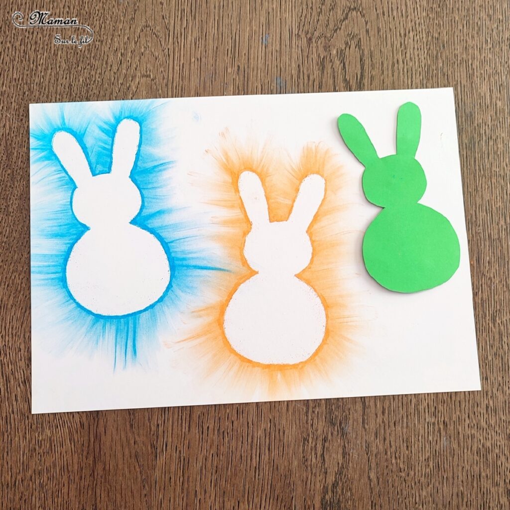 Créer des lapins de Pâques aux pastels étalés : activité créative et manuelle enfants - Technique des pastels étalés au doigt pour un effet lumineux - Pompons pour la queue et le côté mignon - Récup' de chutes de papier pour les pochoirs - Graphismes, découpage, collage - Arts visuels et Bricolage - Thème Pâques et animaux de la ferme - Bricolage facile et rapide - Arts visuels et atelier Maternelle et élémentaire - Créativité - Cycle 1 ou 2 - tutoriel photos - mslf