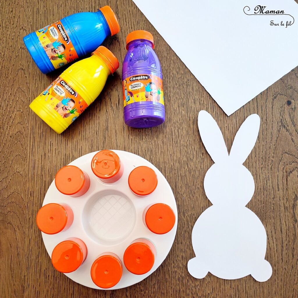 Peindre un lapin et un oeuf de Pâques en peinture au tampon : activité créative et manuelle enfants - Technique de peinture avec un pochoir en papier, de la peinture et des tampons - Silhouette blanche - Pompon pour la queue du lapin - Graphismes noirs pour les décors de l'oeuf de Pâques - Technique de peinture facile et ludique - Arts visuels et Bricolage - Thème Pâques et animaux de la ferme - Bricolage facile et rapide - Arts visuels et atelier Maternelle et élémentaire - Créativité - Cycle 1 ou 2 - tutoriel photos et vidéo - mslf