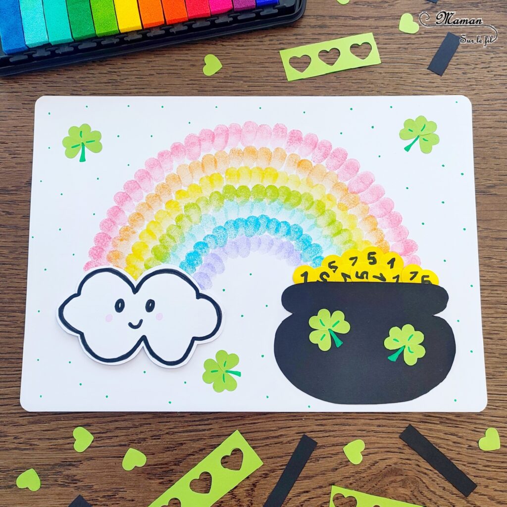 Créer un arc-en-ciel de la Saint-Patrick en empreintes de doigts : activité créative et manuelle enfants - Empreintes de doigts faites avec de l'encre pour tampons - 3 formes de coeur à la perforatrice pour créer les trèfles - Découpage, collage - Dessin et écriture - Chaudron, trésor, pièces, nuages - Arts visuels et Bricolage - Thème Trèfles, Saint-Patrick, Irlande, Géographie, autour du monde - Découverte d'un pays - Bricolage facile et rapide - Arts visuels et atelier Maternelle et élémentaire - Créativité - Cycle 1 ou 2 - tutoriel photos - mslf