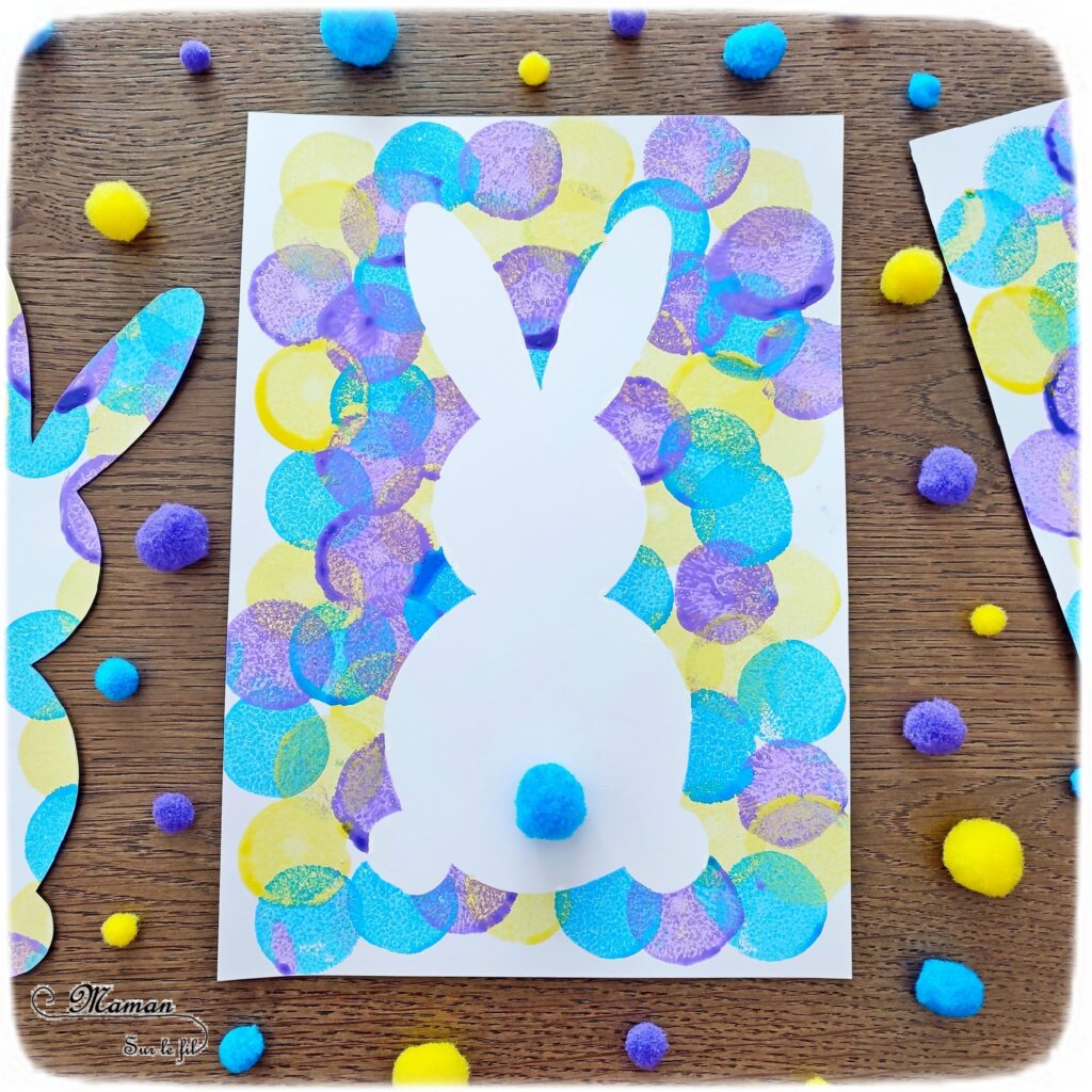 Peindre un lapin et un oeuf de Pâques en peinture au tampon : activité créative et manuelle enfants - Technique de peinture avec un pochoir en papier, de la peinture et des tampons - Silhouette blanche - Pompon pour la queue du lapin - Graphismes noirs pour les décors de l'oeuf de Pâques - Technique de peinture facile et ludique - Arts visuels et Bricolage - Thème Pâques et animaux de la ferme - Bricolage facile et rapide - Arts visuels et atelier Maternelle et élémentaire - Créativité - Cycle 1 ou 2 - tutoriel photos et vidéo - mslf