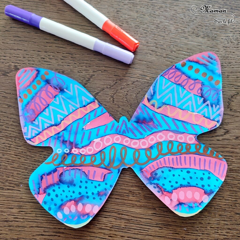 Créer des papillons multicolores en encre et graphismes : activité créative, peinture et manuelle enfants - Colorer le papillon avec de l'encre à dessiner - Suivre les couleurs et décorer avec différents graphismes et couleurs - Effet aborigène graphique - Bricolage sympa et rigolo - Arts visuels Maternelle et cycle 2 - Thème Insectes et petites bêtes, jardin, printemps - Arts visuels et atelier Maternelle et élémentaire - Créativité - Cycle 1 ou 2 - tutoriel photos - mslf