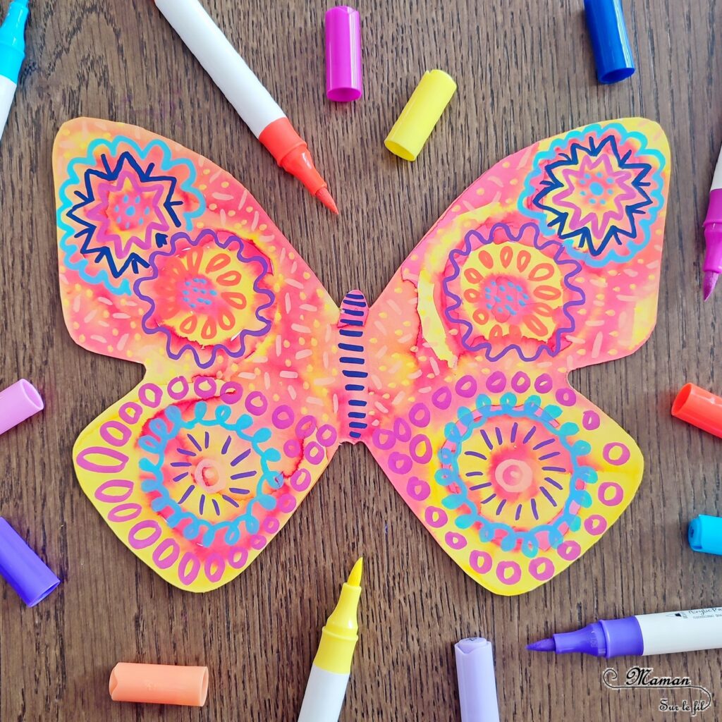 Créer des papillons multicolores en encre et graphismes : activité créative, peinture et manuelle enfants - Colorer le papillon avec de l'encre à dessiner - Suivre les couleurs et décorer avec différents graphismes et couleurs - Effet aborigène graphique - Bricolage sympa et rigolo - Arts visuels Maternelle et cycle 2 - Thème Insectes et petites bêtes, jardin, printemps - Arts visuels et atelier Maternelle et élémentaire - Créativité - Cycle 1 ou 2 - tutoriel photos - mslf