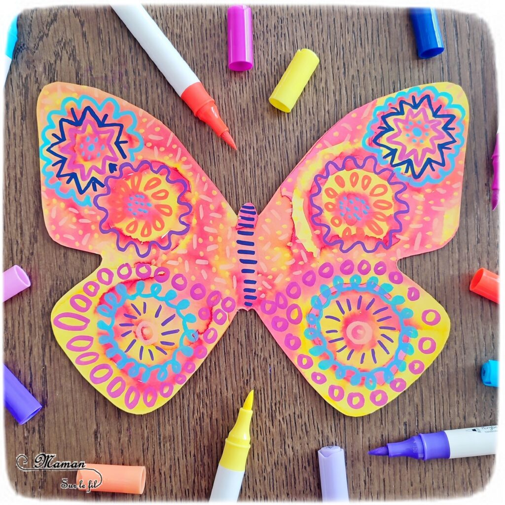 Créer des papillons multicolores en encre et graphismes : activité créative, peinture et manuelle enfants - Colorer le papillon avec de l'encre à dessiner - Suivre les couleurs et décorer avec différents graphismes et couleurs - Effet aborigène graphique - Bricolage sympa et rigolo - Arts visuels Maternelle et cycle 2 - Thème Insectes et petites bêtes, jardin, printemps - Arts visuels et atelier Maternelle et élémentaire - Créativité - Cycle 1 ou 2 - tutoriel photos - mslf