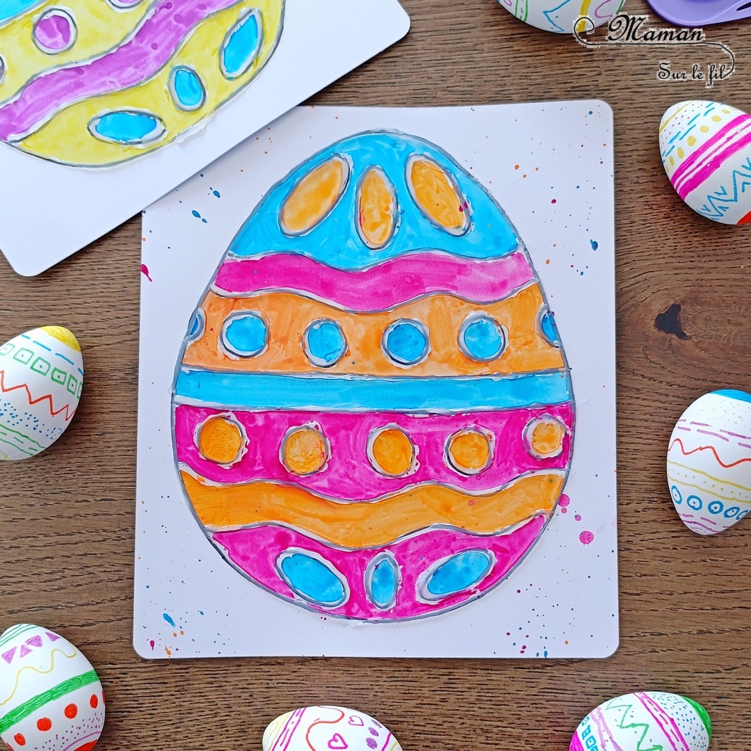 Créer des oeufs de Pâques au pistolet à colle et à la peinture : activité créative, peinture et manuelle enfants - Gabarit gratuit à télécharger pour l'oeuf de Pâques - Dessin de l'oeuf de Pâques au marqueur noir puis au pistolet à colle (colle chaude) - Mise en couleur, coloriage facile à la peinture (palette pour enfants type aquarelle) - Peinture éclaboussée - Simple et joli - Thème Pâques, printemps - Bricolage et décoration sympa et facile - Arts visuels maternelle et élémentaire - Cycles 1 et 2 - Créativité - tutoriel photos et vidéo - mslf