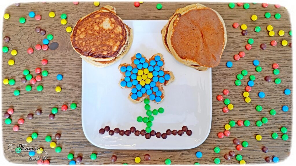Transformer un pancake en fleur avec des bonbons : activité créative, cuisine et manuelle enfants - Cuisiner avec les enfants - Recette de pancake sans sucre ajouté avec de la compote de pommes - Décoration avec des bonbons type smarties ou mini M&M's - Goûter ou petit déjeuner rigolo - Simple, coloré et joli - Thème Fleurs, printemps, couleurs - Décoration sympa et facile - Cuisine maternelle et élémentaire - Cycles 1 et 2 - Créativité - tutoriel photos - mslf