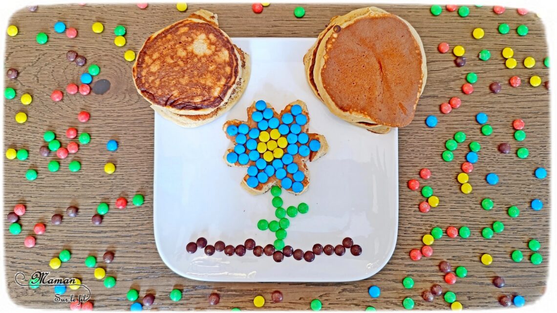 Transformer un pancake en fleur avec des bonbons : activité créative, cuisine et manuelle enfants - Cuisiner avec les enfants - Recette de pancake sans sucre ajouté avec de la compote de pommes - Décoration avec des bonbons type smarties ou mini M&M's - Goûter ou petit déjeuner rigolo - Simple, coloré et joli - Thème Fleurs, printemps, couleurs - Décoration sympa et facile - Cuisine maternelle et élémentaire - Cycles 1 et 2 - Créativité - tutoriel photos - mslf
