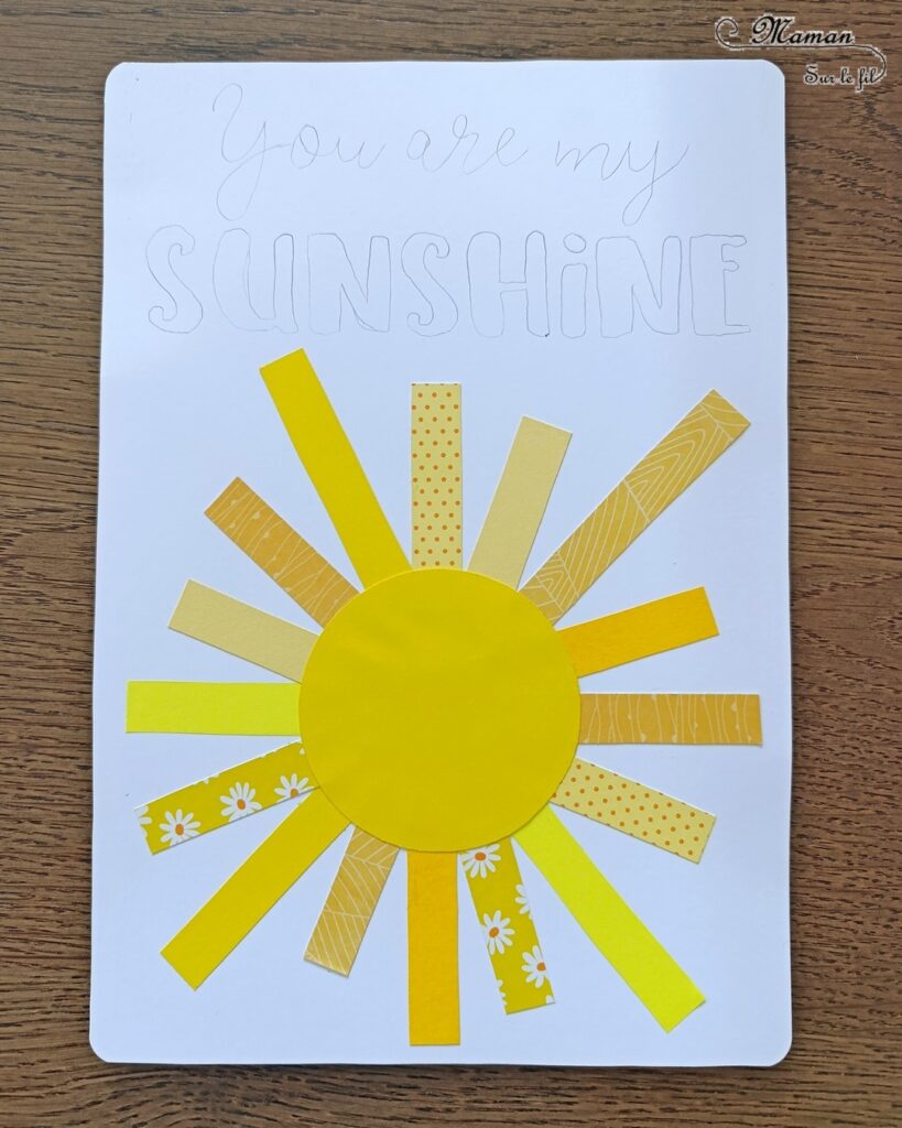 Créer une carte DIY You are my sunshine : activité créative et manuelle enfants - Soleil en bandes de papiers divers - Utilisation de chutes de papier - Géométrie, utilisation de la règle et du compas - Découpage et collage - Calligraphie - Carte à offrir à ceux qu'on aime - Cadeau fait maison - Thème météo, ciel, soleil, été, fête des mères, pères, parents - Bricolage et décoration sympa et facile - Arts visuels maternelle et élémentaire - Cycles 1 et 2 - Créativité - tutoriel photos - mslf