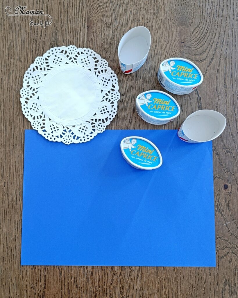 Créer des poissons en récup' de boites à fromage de type Caprice des dieux : activité créative, récup' et manuelle enfants - Recyclage et surcyclage de boites de fromage Caprice des dieux version Mini - Queue et nageoire des poissons avec des napperons - Coeurs et amour -Découpage et collage - Bricolage facile et rigolo - Gommettes Yeux - Thème poissons, animaux marins, mer, océans, été, 1er avril, amour, saint-valentin - Bricolage et décoration sympa et facile - Arts visuels maternelle et élémentaire - Cycles 1 et 2 - Créativité - tutoriel photos - mslf