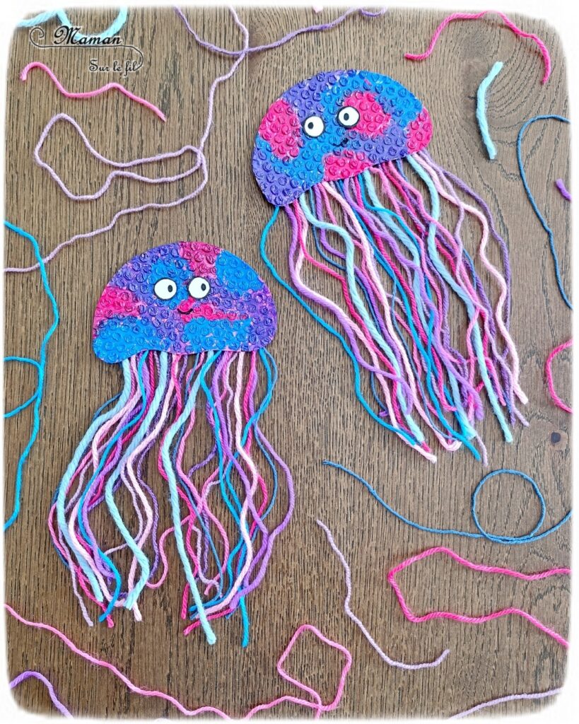 Fabriquer des méduses en papier à bulles et laine : activité créative, peinture, récup' et manuelle enfants - Recyclage et Surcyclage de papier à bulles et de chutes de laines et fils - Peinture rose, bleue, violette sur le papier à bulles - Consolidation avec du papier cartonné - Scotchage de la laine au dos - Yeux rigolos - Bricolage facile et rigolo - Thème animaux marins, océans, mer, été - Bricolage et décoration sympa et facile - Arts visuels maternelle et élémentaire - Cycles 1 et 2 - Créativité - tutoriel photos - mslf