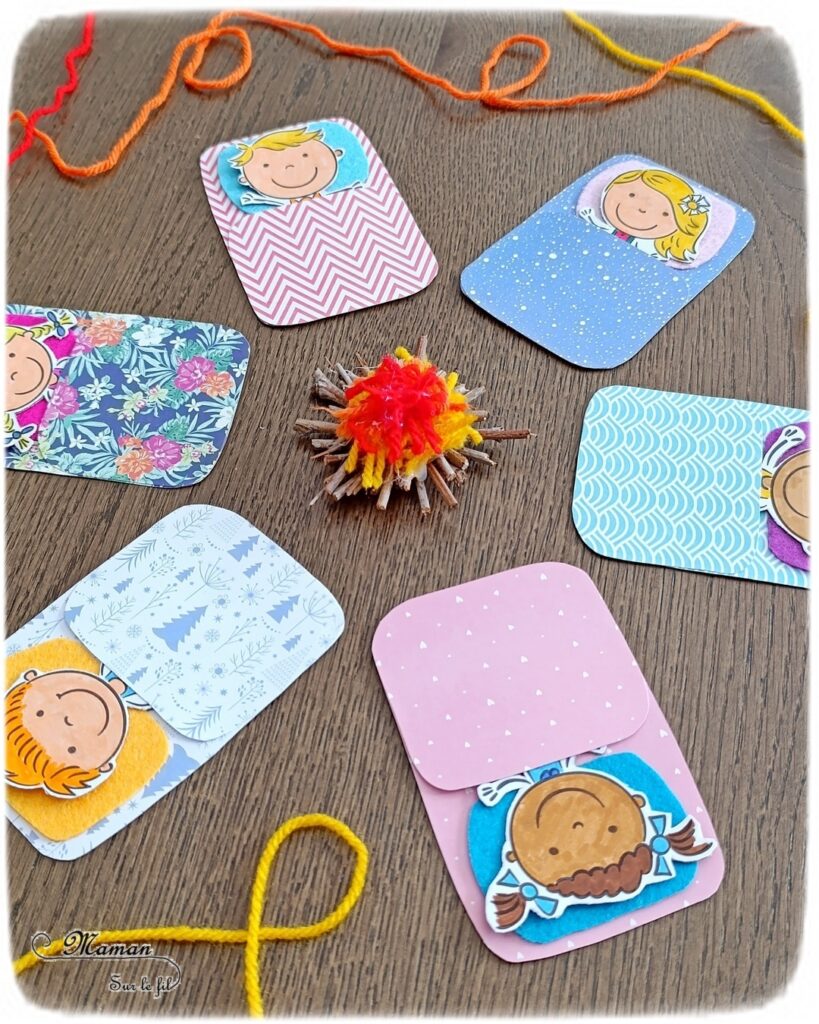 Fabriquer des enfants dans leur duvet, allongés autour d'un min feu de camp : activité créative, coloriage et manuelle enfants - Bricolage facile pour jeu d'imagination et d'imitation DIY - Coloriage aux feutres, découpage, collage - Récup' de carton - Papiers à motifs type scrapbooking, feutrine - Mini feu de camp avec petites branches et laine - Campement avec avec feu de camp - Nuit à la belle étoile en colonie - Thème camping, vacances, été, colonies, camp d'été - Bricolage et décoration sympa et facile - Arts visuels maternelle et élémentaire - Cycles 1 et 2 - Créativité - tutoriel photos - mslf