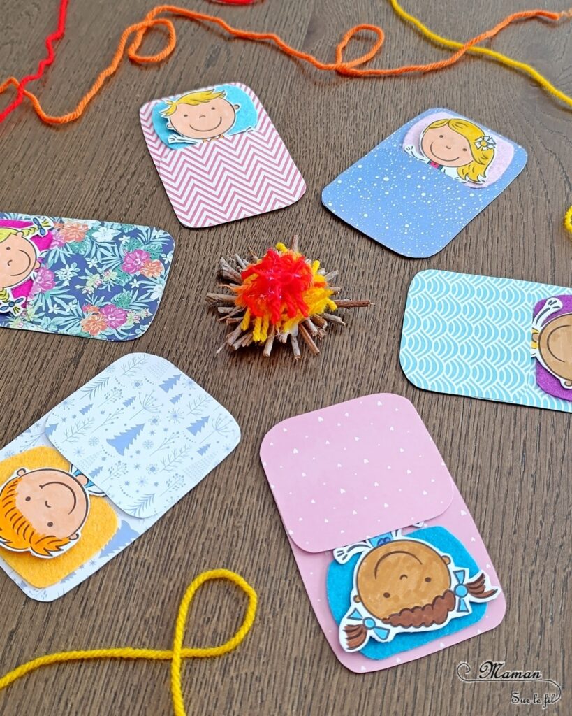 Fabriquer des enfants dans leur duvet, allongés autour d'un min feu de camp : activité créative, coloriage et manuelle enfants - Bricolage facile pour jeu d'imagination et d'imitation DIY - Coloriage aux feutres, découpage, collage - Récup' de carton - Papiers à motifs type scrapbooking, feutrine - Mini feu de camp avec petites branches et laine - Campement avec avec feu de camp - Nuit à la belle étoile en colonie - Thème camping, vacances, été, colonies, camp d'été - Bricolage et décoration sympa et facile - Arts visuels maternelle et élémentaire - Cycles 1 et 2 - Créativité - tutoriel photos - mslf