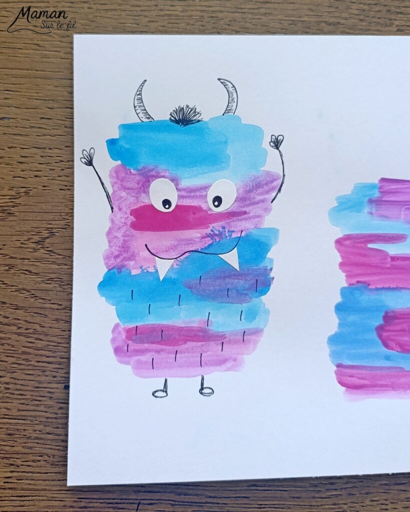 Peindre une famille de petits monstres mignons et colorés : activité créative, peinture et manuelle enfants - Peinture façon aquarelle - Bandes gribouillées - Couleurs bleu, rose et violet - Dessin des détails en noir pour le contraste - Découpage et collage des yeux et dents pour un air rigolo - Bricolage et décoration DIY et facile - Bricolage Fait maison, décoration - Thème Halloween, créatures imaginaires, monstres - Bricolage sympa et facile - Arts visuels Maternelle et cycle 2 - Maternelle et élémentaire - Créativité - Cycle 1 ou 2 - tutoriel photos - mslf