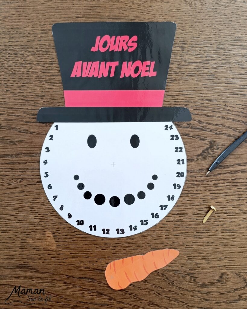 Fabriquer un décompte de l'Avent DIY - Bonhomme de neige : activité créative et manuelle enfants - Nez Carotte qui tourne et permet de décompter les jours pour patienter avant Noël - Calendrier, décompte de l'Avent, de Noël fait maison en papier - Version PDF à télécharger et imprimer gratuitement - Printable gratuit - Bricolage et décoration DIY - Bricolage Fait maison, décoration - Thème Hiver, froid, neige, Noël, Avent - Bricolage sympa et facile - Arts visuels Maternelle et cycle 2 - Maternelle et élémentaire - Créativité - Cycle 1 ou 2 - tutoriel photos et vidéo - mslf