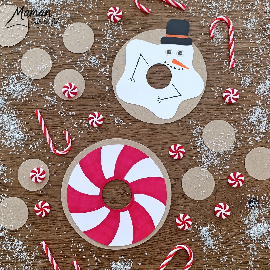 Fabriquer des donuts gourmands d'hiver en carton et papier : activité créative, récup' et manuelle enfants - Version bonhomme de neige et sucre d'orge - Découpage et collage de papier - Recyclage, surcyclage de carton fin - Géométrie, utilisation du compas, cercles - Dessin, coloriage - Bricolage et décoration DIY et facile - Bricolage Fait maison, décoration - Thème hiver, froid, neige, gourmandises, bonbons, Noël - Bricolage sympa et facile - Arts visuels Maternelle et cycle 2 - Maternelle et élémentaire - Créativité - Cycle 1 ou 2 - tutoriel photos - mslf