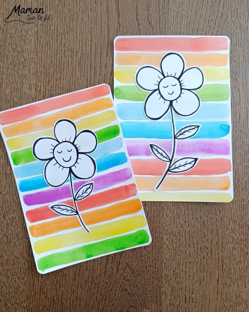 Créer une fleur en noir et blanc sur fond coloré Arc-en-ciel : activité créative, peinture et manuelle enfants - Peinture type aquarelle - Tracé de lignes horizontales aux couleurs de l'arc-en-ciel - Dessin de la fleur au feutre noir - Découpage, collage, contraste - Cadeau DIY, fait maison à offrir - Bricolage facile - Thème fleurs, nature, printemps - Bricolage et décoration sympa et facile - Arts visuels maternelle et élémentaire - Cycles 1 et 2 - Créativité - tutoriel photos - mslf