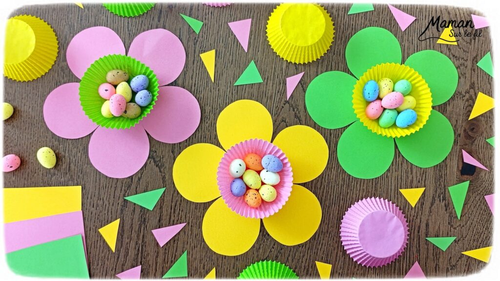 Fabriquer des fleurs printanières remplies d'oeufs de Pâques : activité créative et manuelle enfants - Activité de transition entre le printemps et Pâques - Fleurs aux couleurs de printemps avec papier et caissettes à cupcake - - Coeur comme un panier rempli de petits oeufs de Pâques en sucre ou en polystyrène - Décoration DIY Fait maison - Cadeau DIY, fait maison à offrir - Bricolage facile - Thème fleurs, nature, printemps, Pâques, gourmandises, chocolat, bonbons - Bricolage et décoration sympa et facile - Arts visuels maternelle et élémentaire - Cycles 1 et 2 - Créativité - tutoriel photos - mslf