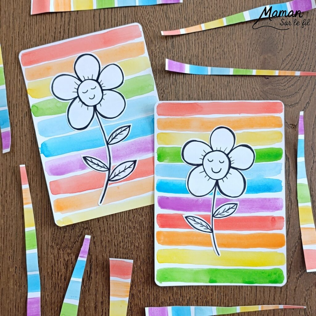 Créer une fleur en noir et blanc sur fond coloré Arc-en-ciel : activité créative, peinture et manuelle enfants - Peinture type aquarelle - Tracé de lignes horizontales aux couleurs de l'arc-en-ciel - Dessin de la fleur au feutre noir - Découpage, collage, contraste - Cadeau DIY, fait maison à offrir - Bricolage facile - Thème fleurs, nature, printemps - Bricolage et décoration sympa et facile - Arts visuels maternelle et élémentaire - Cycles 1 et 2 - Créativité - tutoriel photos - mslf