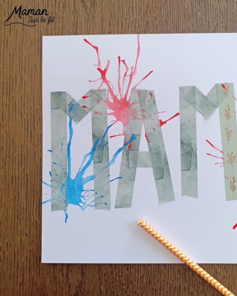 Créer une carte Maman en peinture soufflée à la paille : activité créative, peinture et manuelle enfants - Mot Maman écrit au washi ou masking tape - Tâches de peinture colorées soufflée à la paille pour un effet moderne, pop art, tag - Carte colorée, joyeux pour la fête des mères ou des pères - Cadeau DIY - Décoration DIY Fait maison - Arts visuels et Bricolage facile - Thème amour, amitié, Saint Valentin, fête des grands-mères, mères, grands-pères, pères - Bricolage et décoration sympa et facile - Arts visuels maternelle et élémentaire - Cycles 1 et 2 - Créativité - tutoriel photos - mslf