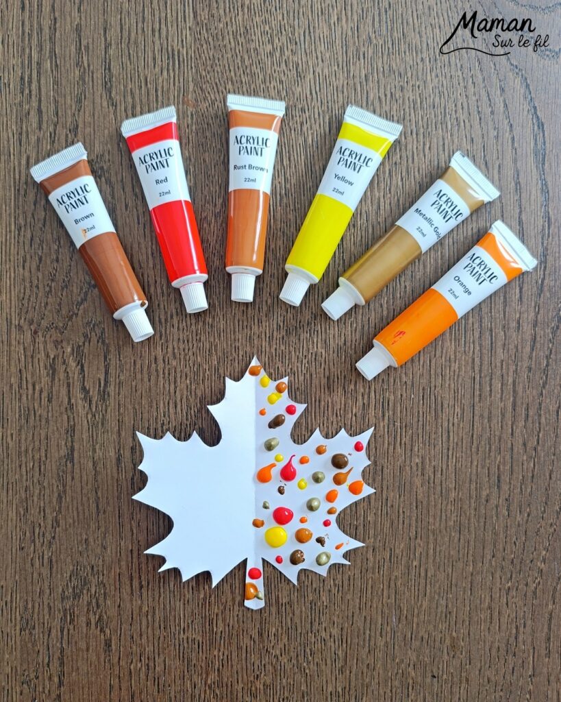 Créer une guirlande de feuilles mortes d'automne en peinture symétrique : activité créative, peinture et manuelle - Découpage des feuilles et peinture par symétrie en pliant le papier en deux - Technique de peinture pour aborder la symétrie - Couleurs chaudes et automnales - Scotchage à un fil ou à un bout de laine pour en faire une guirlande à suspendre, une suspension pour décorer - Bricolage et décoration DIY et facile - Bricolage Fait maison, décoration - Thème Forêts, Arbres, feuilles mortes, automne - Bricolage sympa et facile - Arts visuels Maternelle et cycle 2 - Maternelle et élémentaire - Créativité et lecture jeunesse - Cycle 1 ou 2 - tutoriel photos - mslf