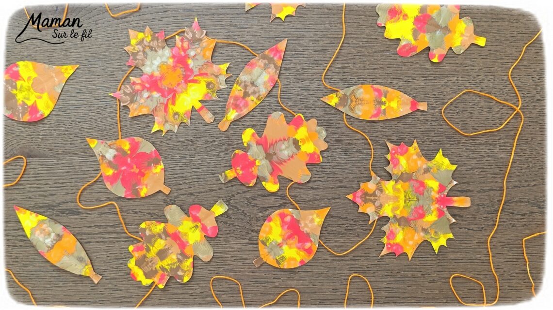 Créer une guirlande de feuilles mortes d'automne en peinture symétrique : activité créative, peinture et manuelle - Découpage des feuilles et peinture par symétrie en pliant le papier en deux - Technique de peinture pour aborder la symétrie - Couleurs chaudes et automnales - Scotchage à un fil ou à un bout de laine pour en faire une guirlande à suspendre, une suspension pour décorer - Bricolage et décoration DIY et facile - Bricolage Fait maison, décoration - Thème Forêts, Arbres, feuilles mortes, automne - Bricolage sympa et facile - Arts visuels Maternelle et cycle 2 - Maternelle et élémentaire - Créativité et lecture jeunesse - Cycle 1 ou 2 - tutoriel photos - mslf