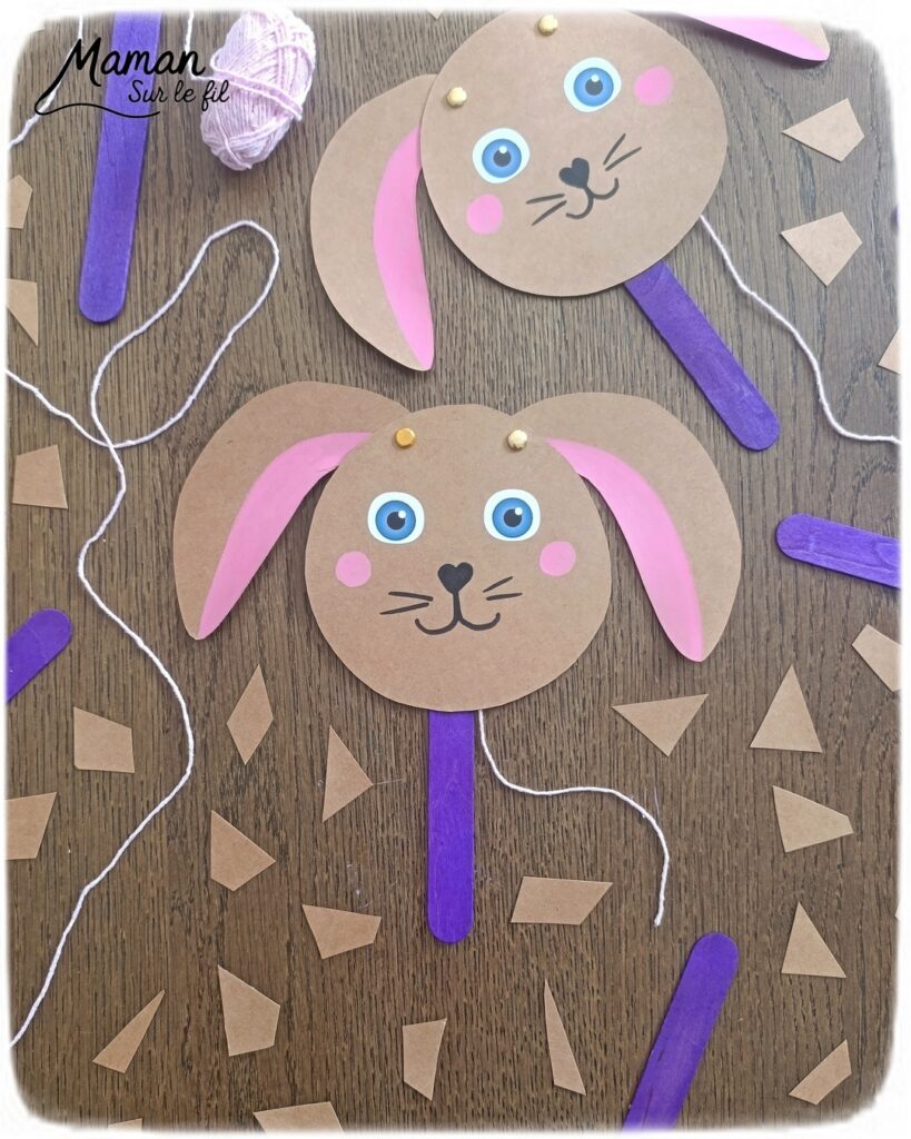 Fabriquer un lapin mignon aux oreilles articulées : activité créative, papier et manuelle enfants - Bricolage rigolo type marionnette - Découpage de papier - Récup', recyclage, surcyclage de bâtonnet de glace en bois - Articulation avec attaches parisiennes et fils / laine - Gommettes, dessin et coloriage - Arts visuels et Bricolage facile - Thème animaux de la ferme, campagne, pâques - Bricolage et décoration sympa et facile - Arts visuels maternelle et élémentaire - Cycles 1 et 2 - Créativité - tutoriel photos et vidéo - mslf