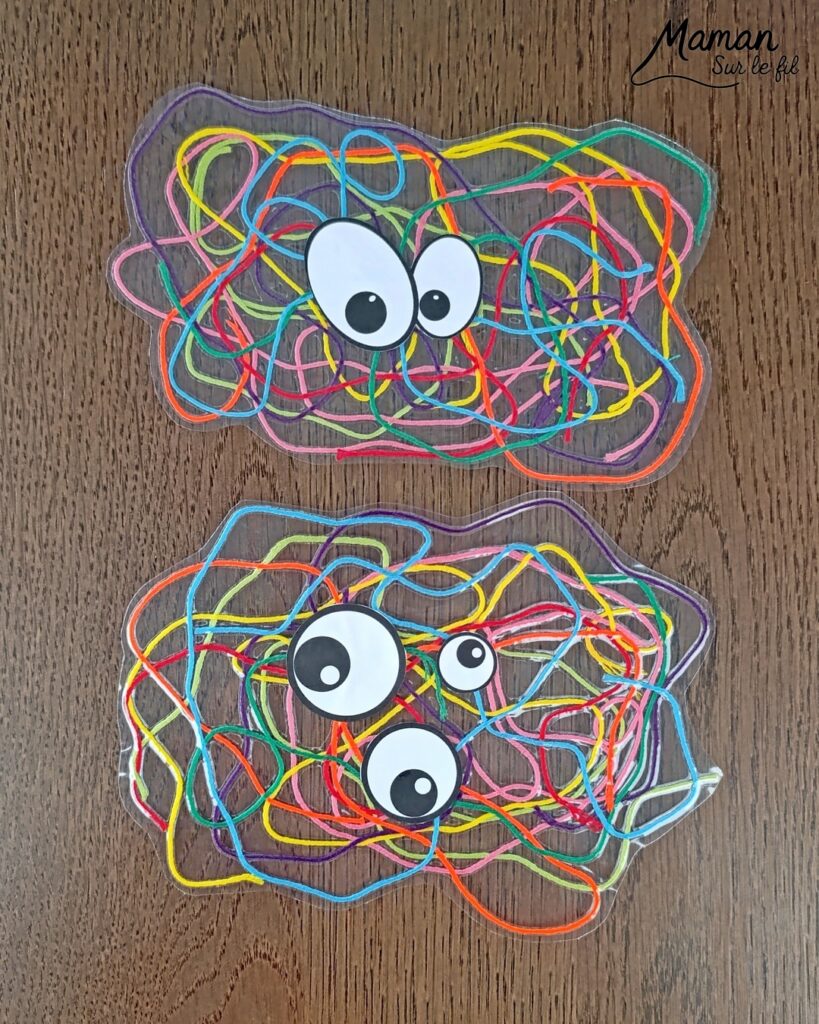 Créer des monstres colorés en laine plastifiée : activité créative, rigolote et manuelle - Laine, fils de broderie multicolores collé ou plastifié pour faire une forme aléatoire de monstres - Yeux rigolos découpés et collés pour finir - Découpage, collage - Tête de monstre rigolote - Bricolage et décoration DIY et facile - Bricolage Fait maison, décoration - Thème Halloween, monstres, créatures imaginaires et légendaires - Bricolage sympa et facile - Arts visuels Maternelle et cycle 2 - Maternelle et élémentaire - Créativité - Cycle 1 ou 2 - tutoriel photos et vidéo - mslf